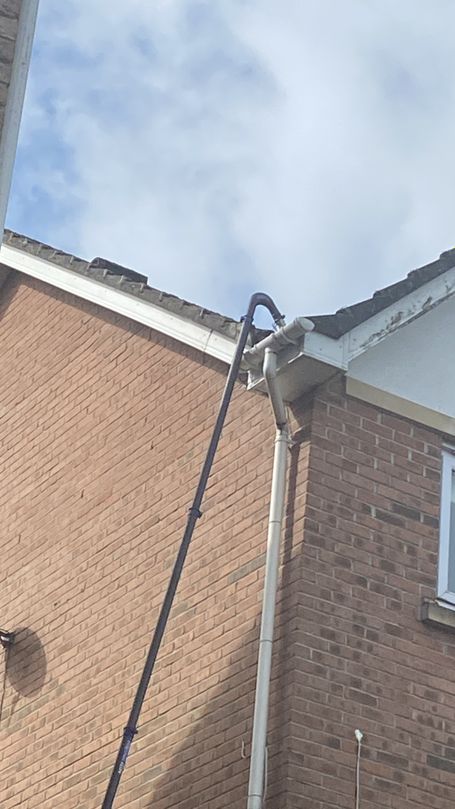 pole up to gutter on house