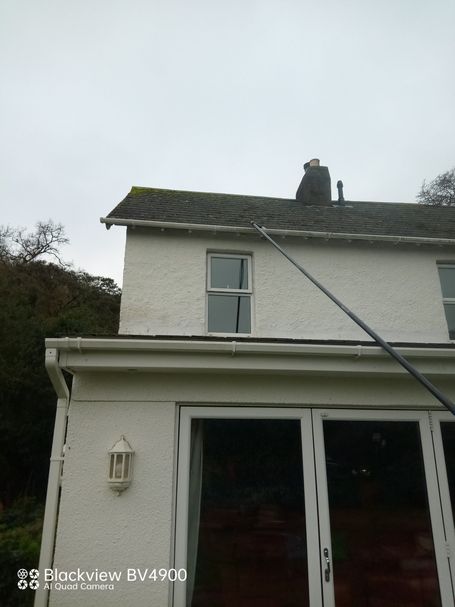 pole over extension of house with windows, doors and gutters