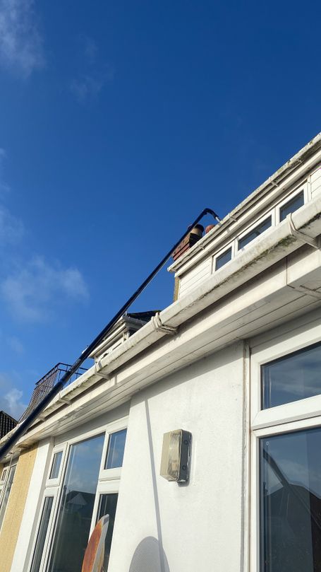 poles going to gutter at top of house