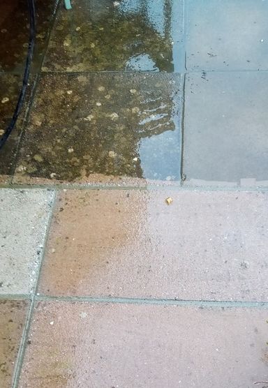 patio slabs half dirty, half clean