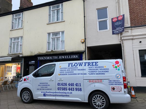 van in front of shop front