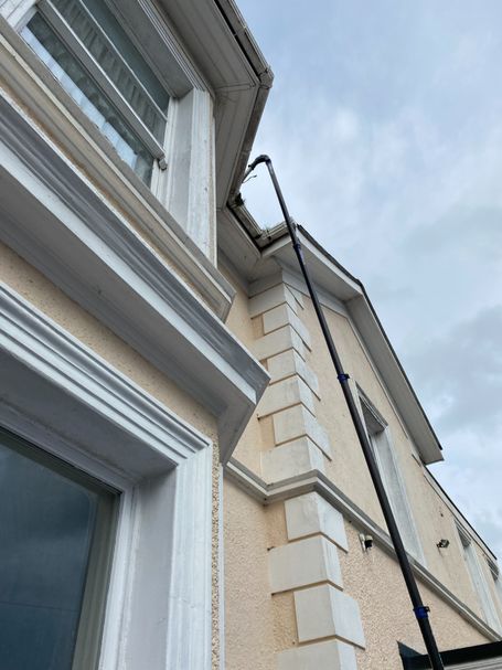 side of house with pole to gutter