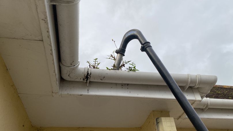 pipe over weed in gutter