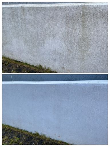 comparison of white garden wall before and after soft washing