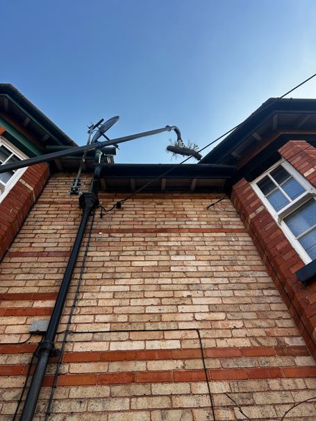 POLE REMOVING WEED FROM GUTTER, WALL , DOWN PIPE, WINDOWS, BLUE SKY