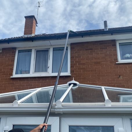 pole reaching roof over conservatory