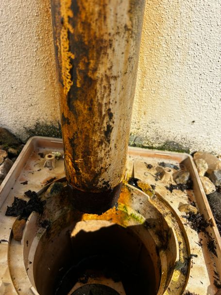 blocked downpipe over drain