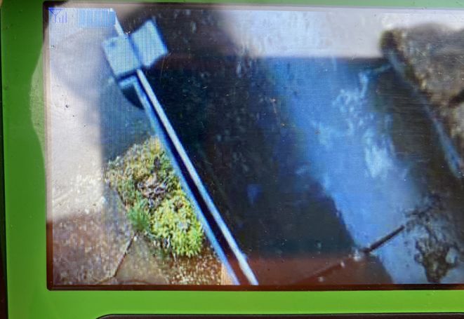 cctv camera screen of inside of gutter