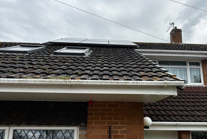 roof with solar panels windows and gutters